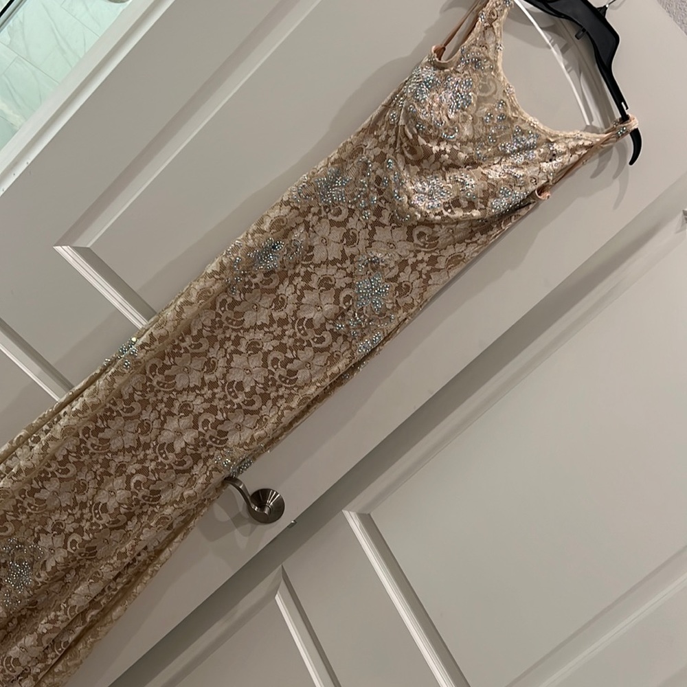 Beautiful Jovani dress. Very Fancy. It is stretchy and has a short train.